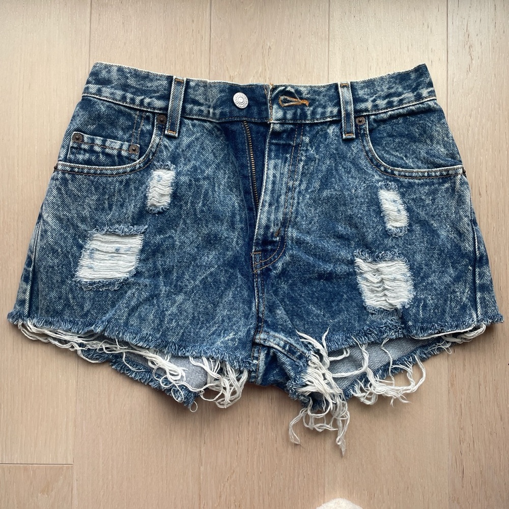 Levi's vintage blue denim shorts with frayed hem and distressed Size: 27
